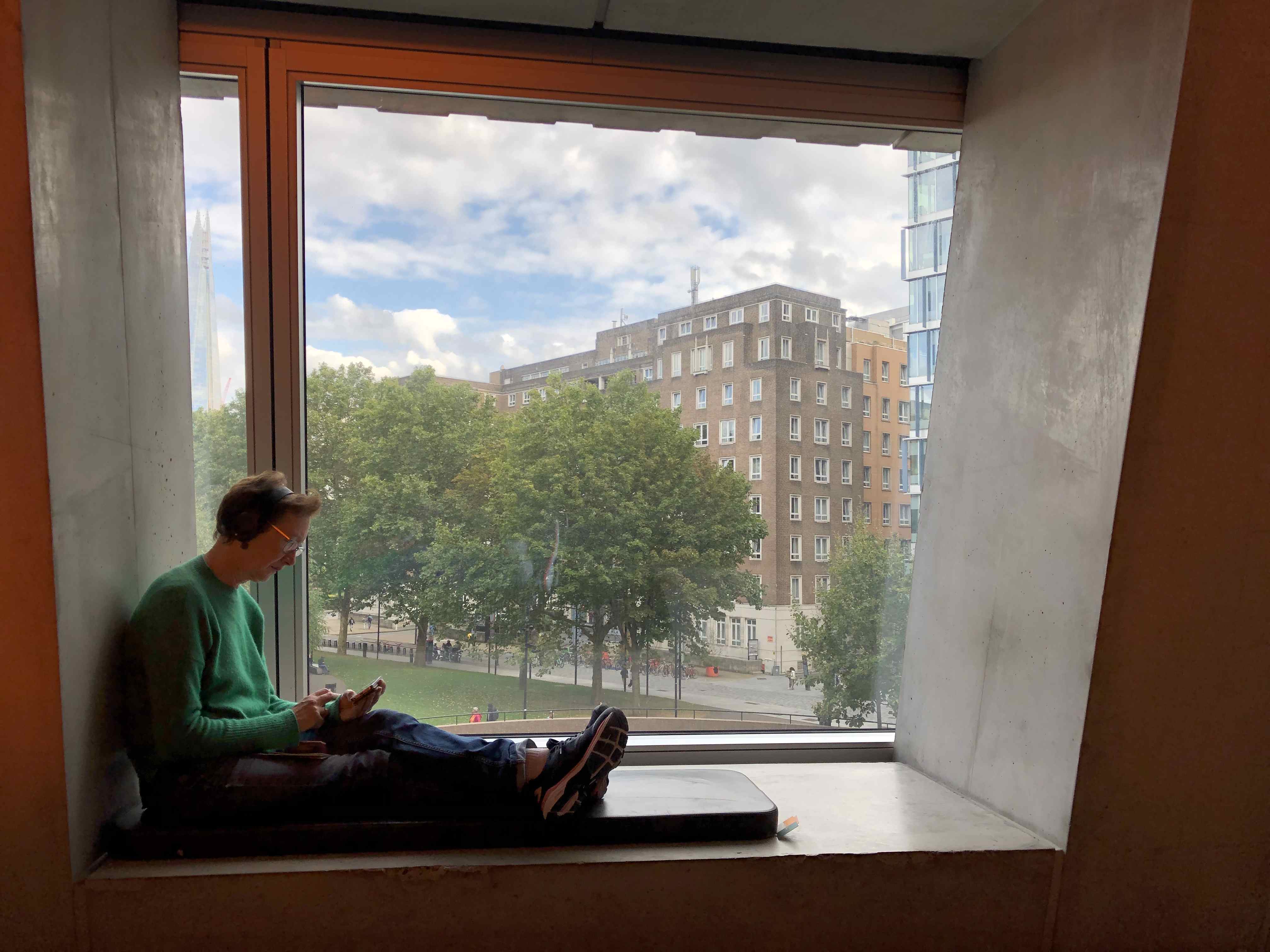 Man sitting in front of window